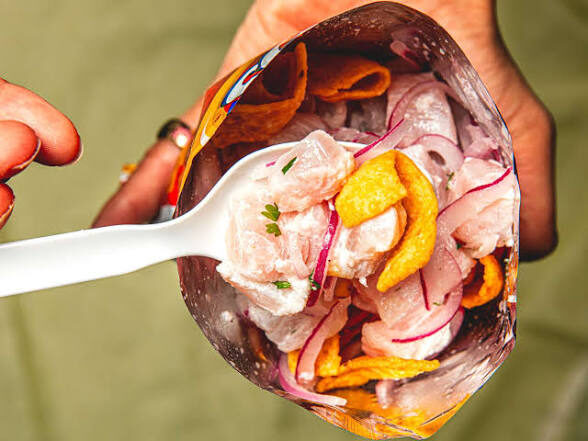 Fresh ceviche poured into a Picaritas chip bag — the classic Costa Rican caldosa street food