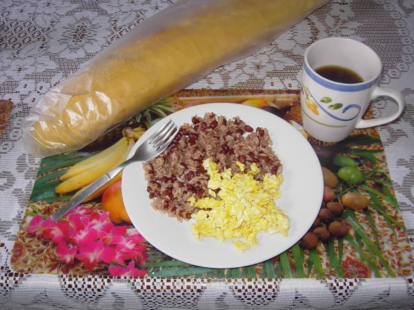 A traditional Costa Rican breakfast of gallo pinto and scrambled eggs with coffee, cooked by a private chef in Jaco Beach