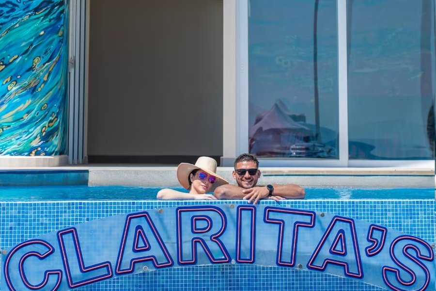 The Clarita's pool sign at Clarita's Beach Resort in Jacó, Costa Rica