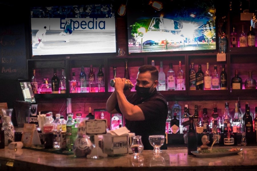 Bartender behind the bar at Jaco Bar