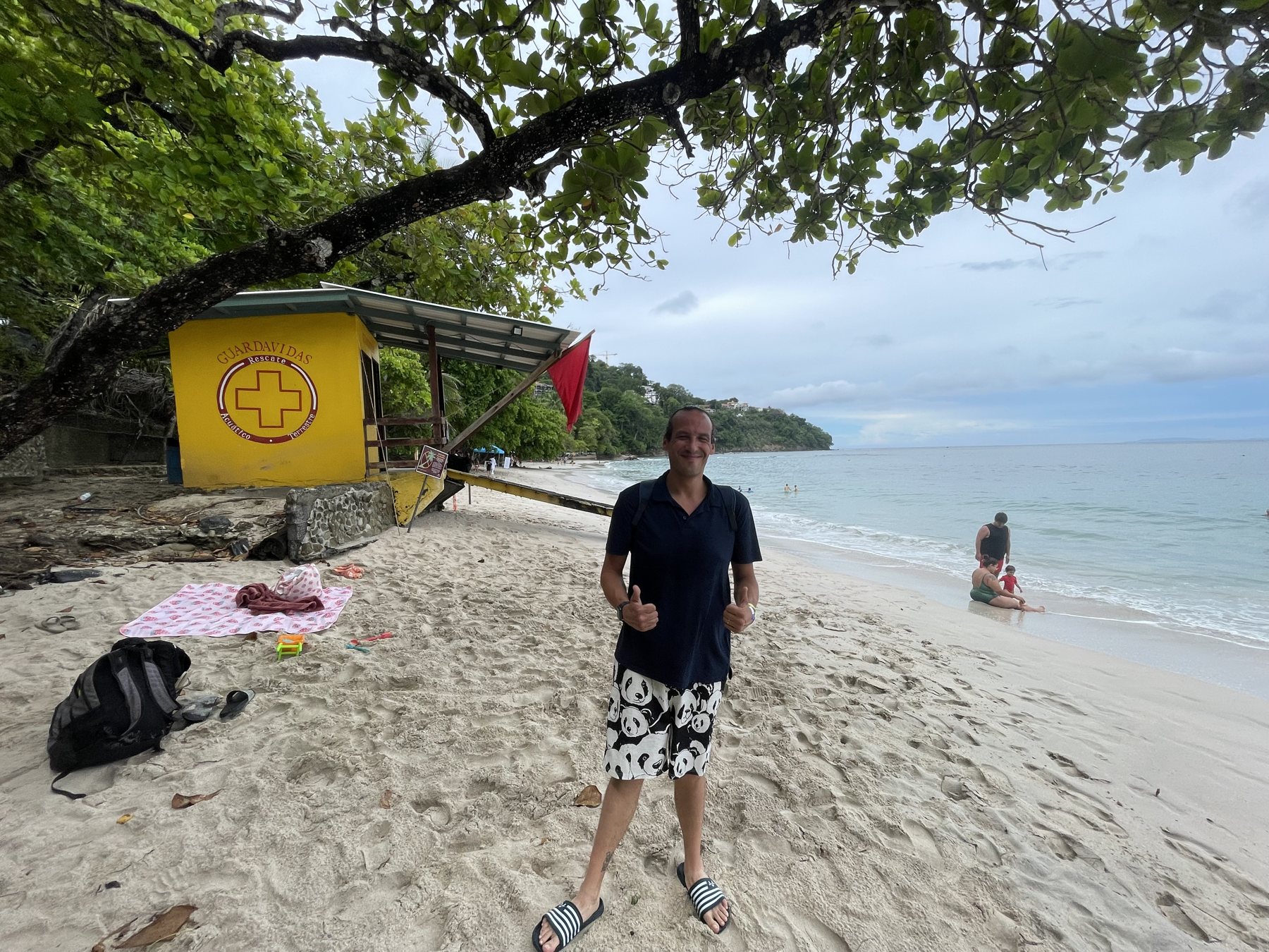 A guest enjoying the quiet white-sand beach at Playa Blanca near the Punta Leona condo — Playa Blanca real estate near Jaco