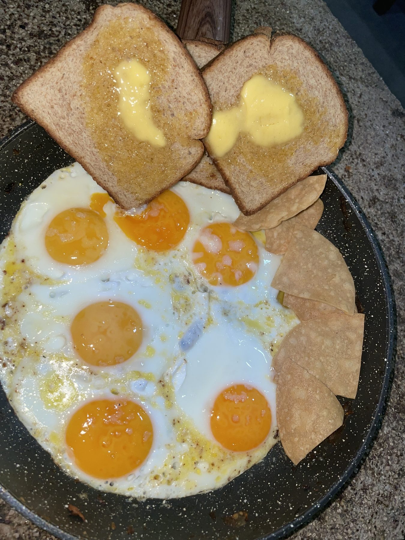 A chef-made breakfast of eggs and toast in a Jaco villa