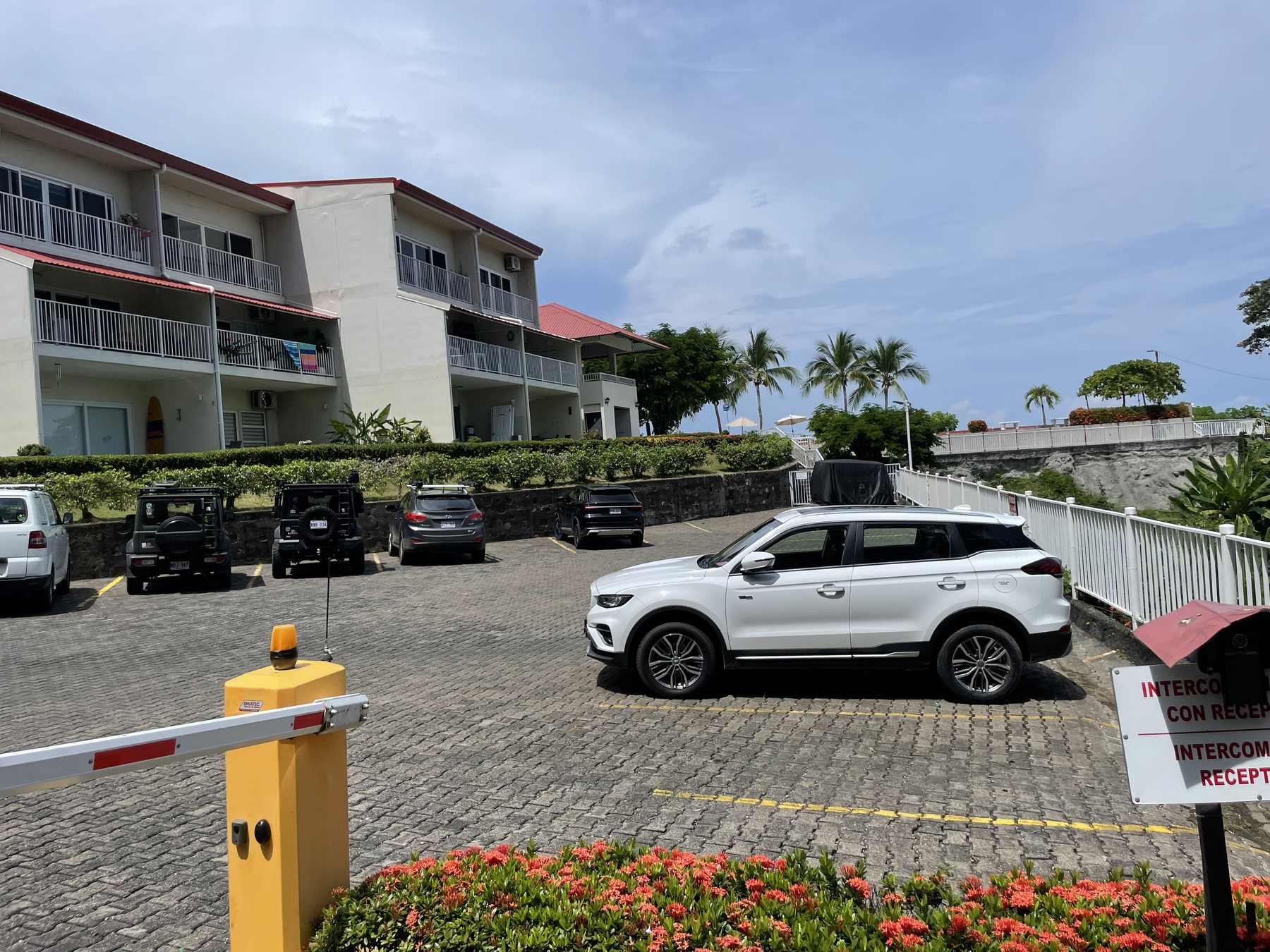 Oceanfront condo building with owner parking in a gated community above Playa Blanca — best properties near Jaco Beach, Costa Rica
