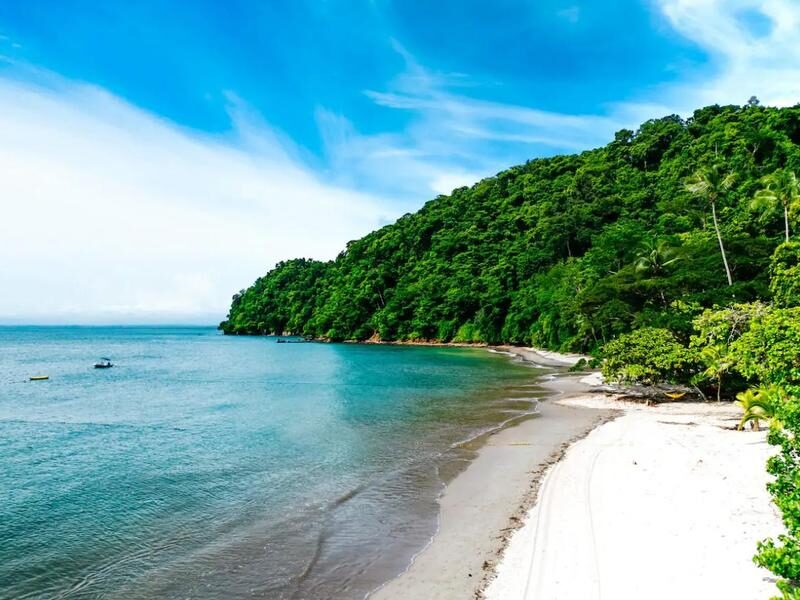 White-sand beach at Playa Blanca near Punta Leona — best places to buy real estate near Jaco Beach, Costa Rica