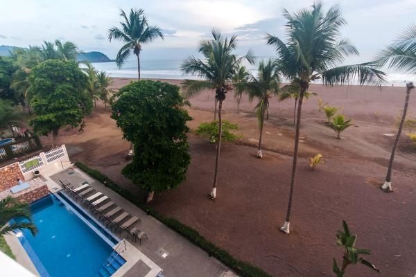 Condo VIP 12 — The Palms 402 beachfront condo in Jacó Beach