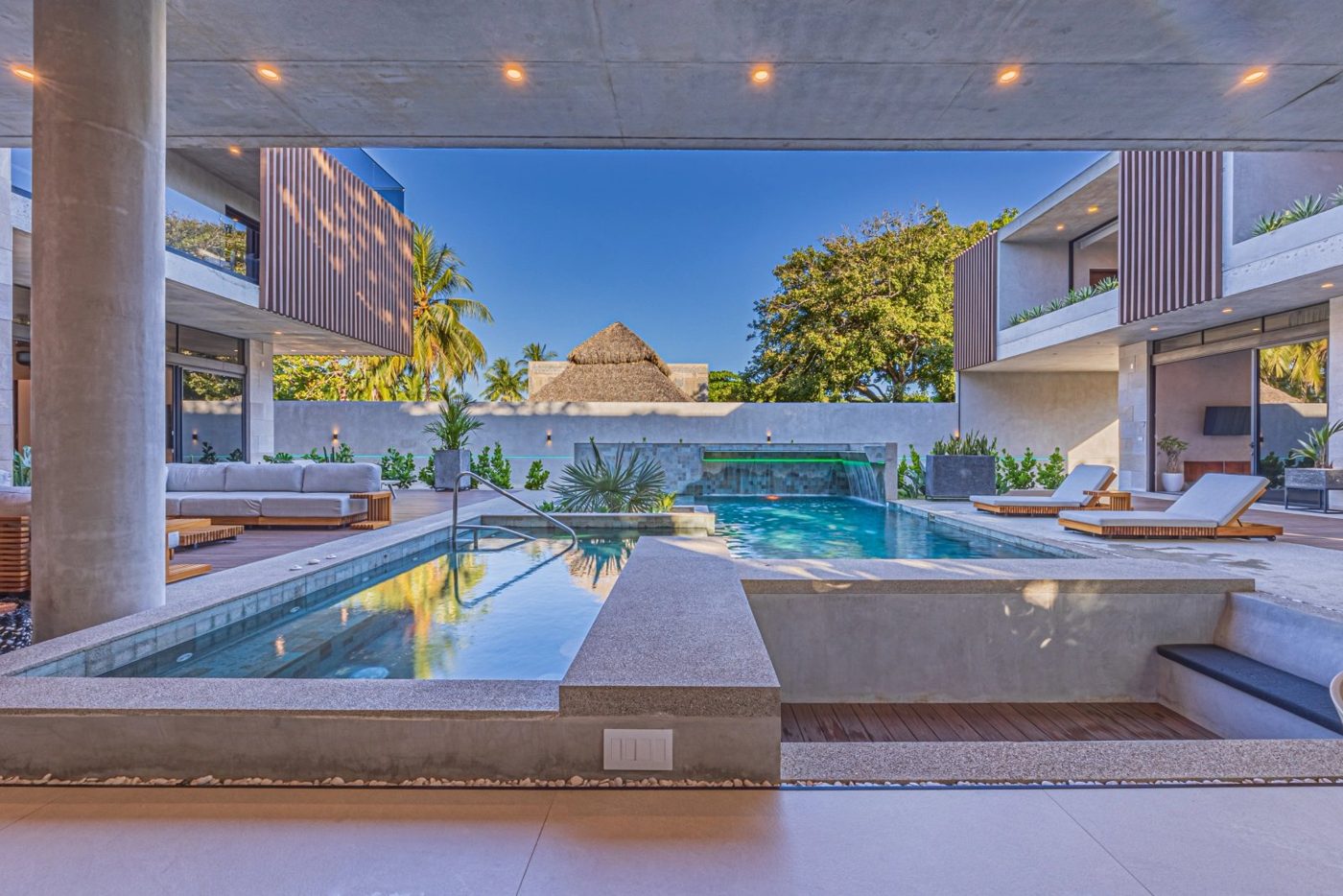 Casa VIP 1 luxury beachfront villa in Jacó — three-story villa exterior at dusk