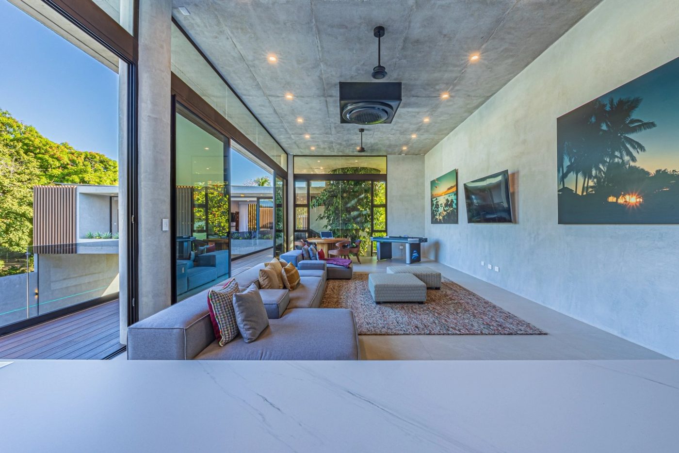 Casa VIP 1 luxury beachfront villa in Jacó — open-air lounge with ocean-view art