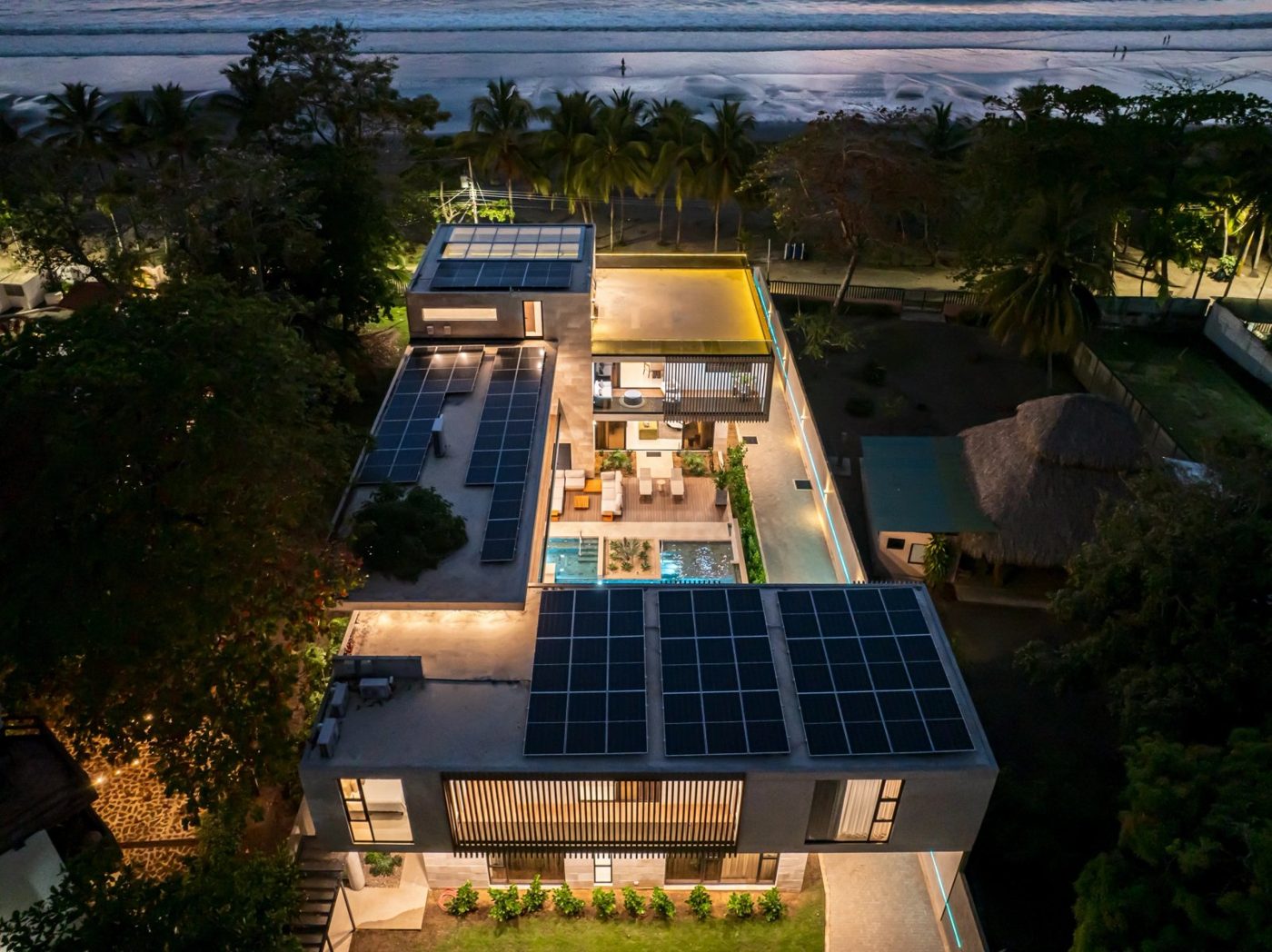 Casa VIP 1 luxury beachfront villa in Jacó — blue-glass pool feature