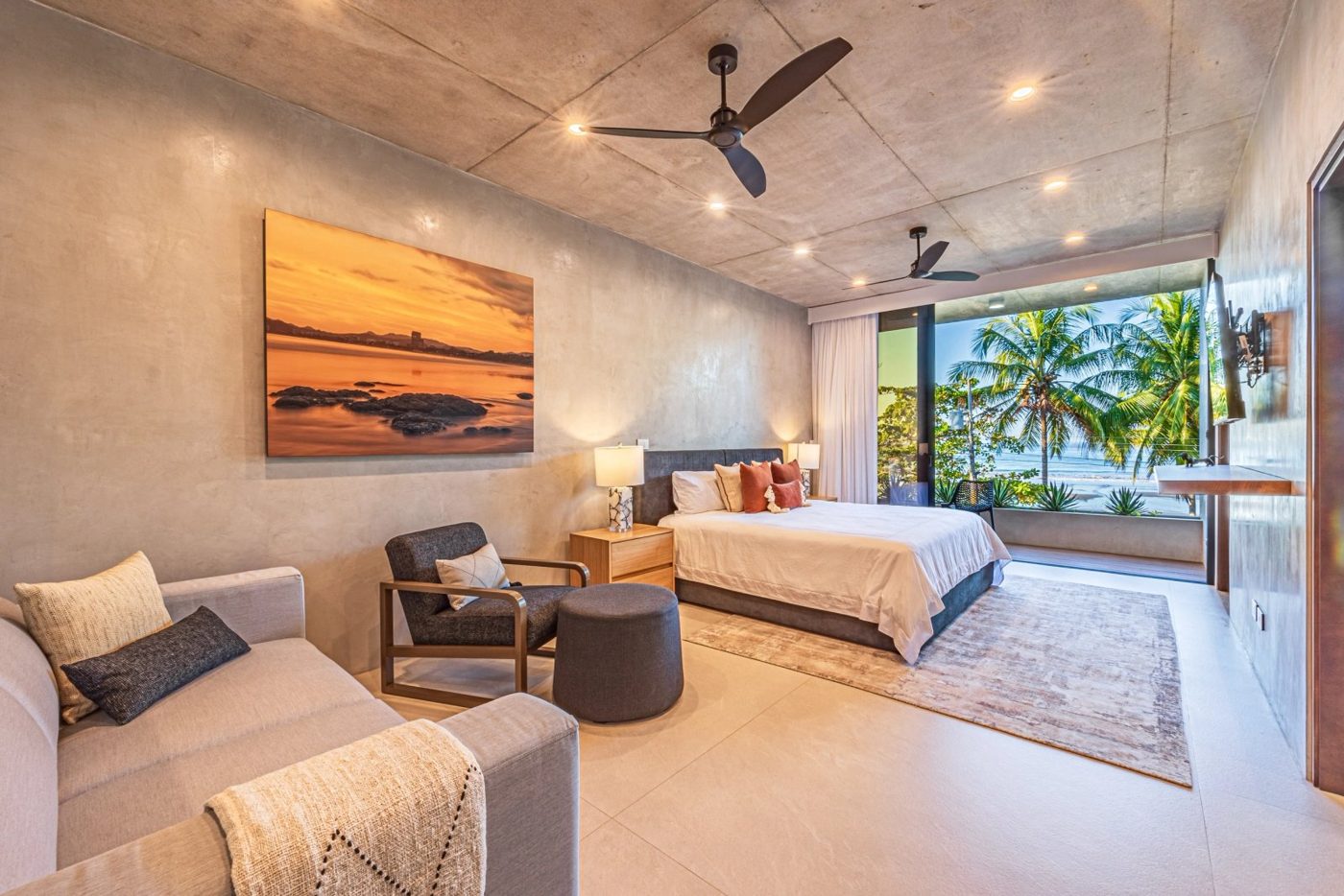 Casa VIP 1 luxury beachfront villa in Jacó — living area opening to the deck