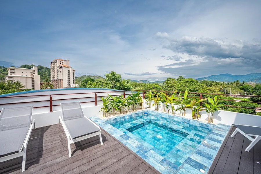 Casa VIP 12 — 10-suite beachfront villa in Jacó, rooftop pool with ocean views