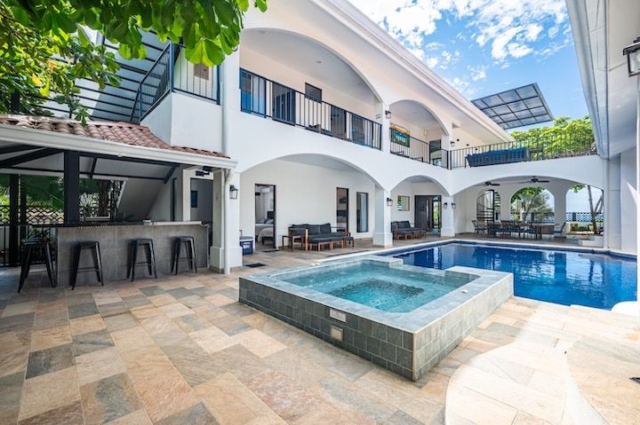Casa VIP 6 — 11-bedroom beachfront villa in Jacó Beach, elevated view of the beachfront villa and pool
