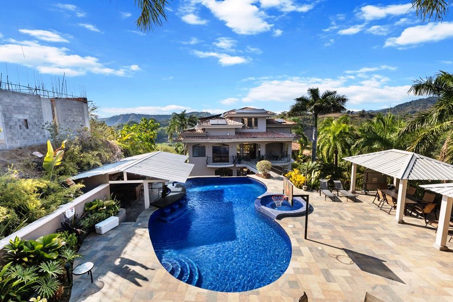 Casa VIP 8 — 13-suite luxury villa in Jacó Beach, pool and villa from the deck