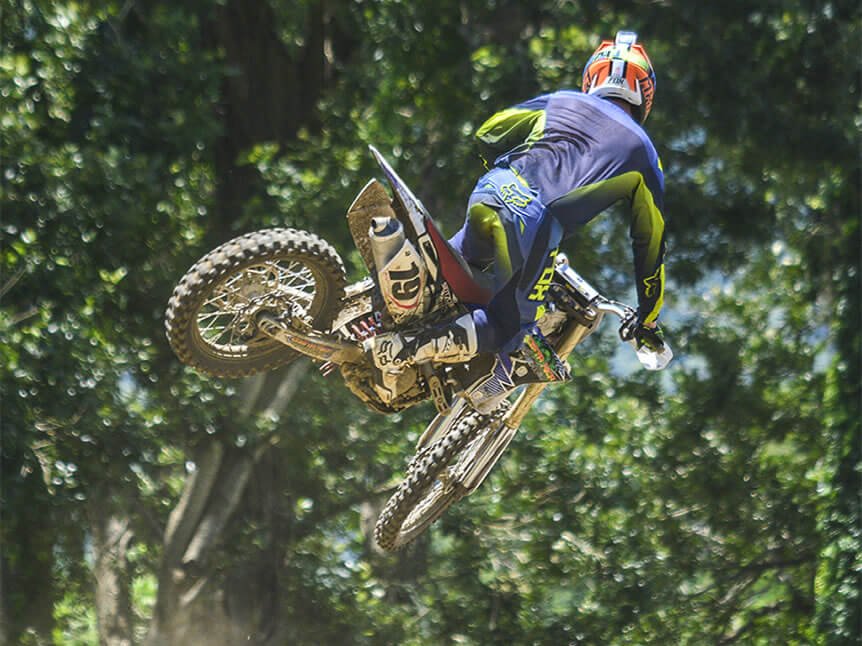 Dirt bike jump above the green Costa Rican hills