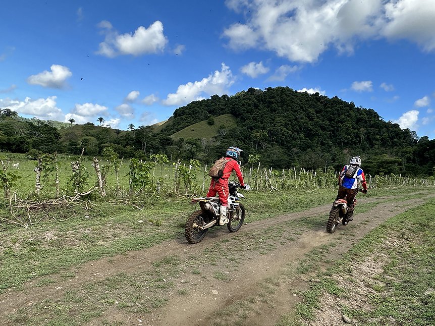 Two riders on an open mountain track